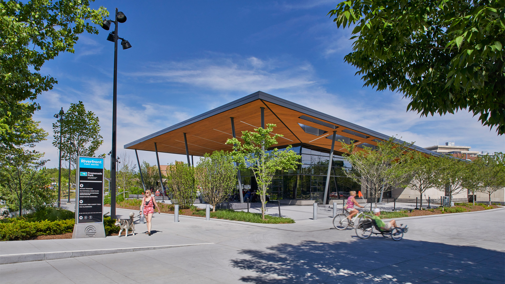 Promenade Park Pavilion exterior with people in front enjoying nature.