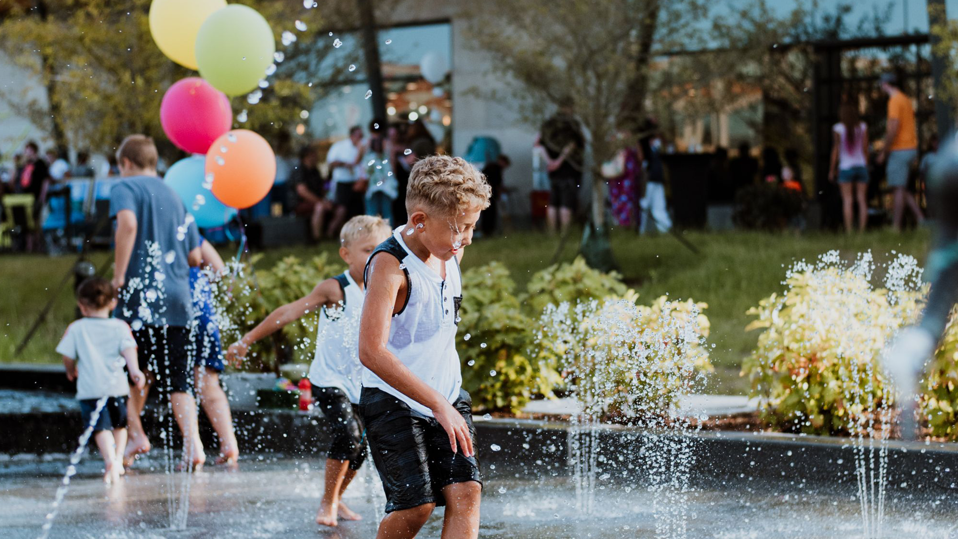 Kids having fun playing at the Promenade Park splash pad