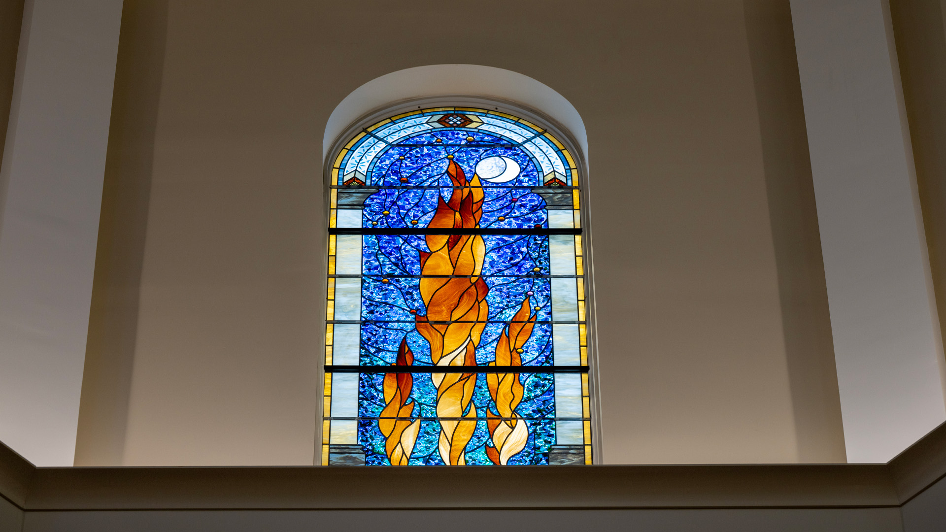 Interior of the University of Saint Francis Chapel of St Francis of Assisi, detailed stained glass window.