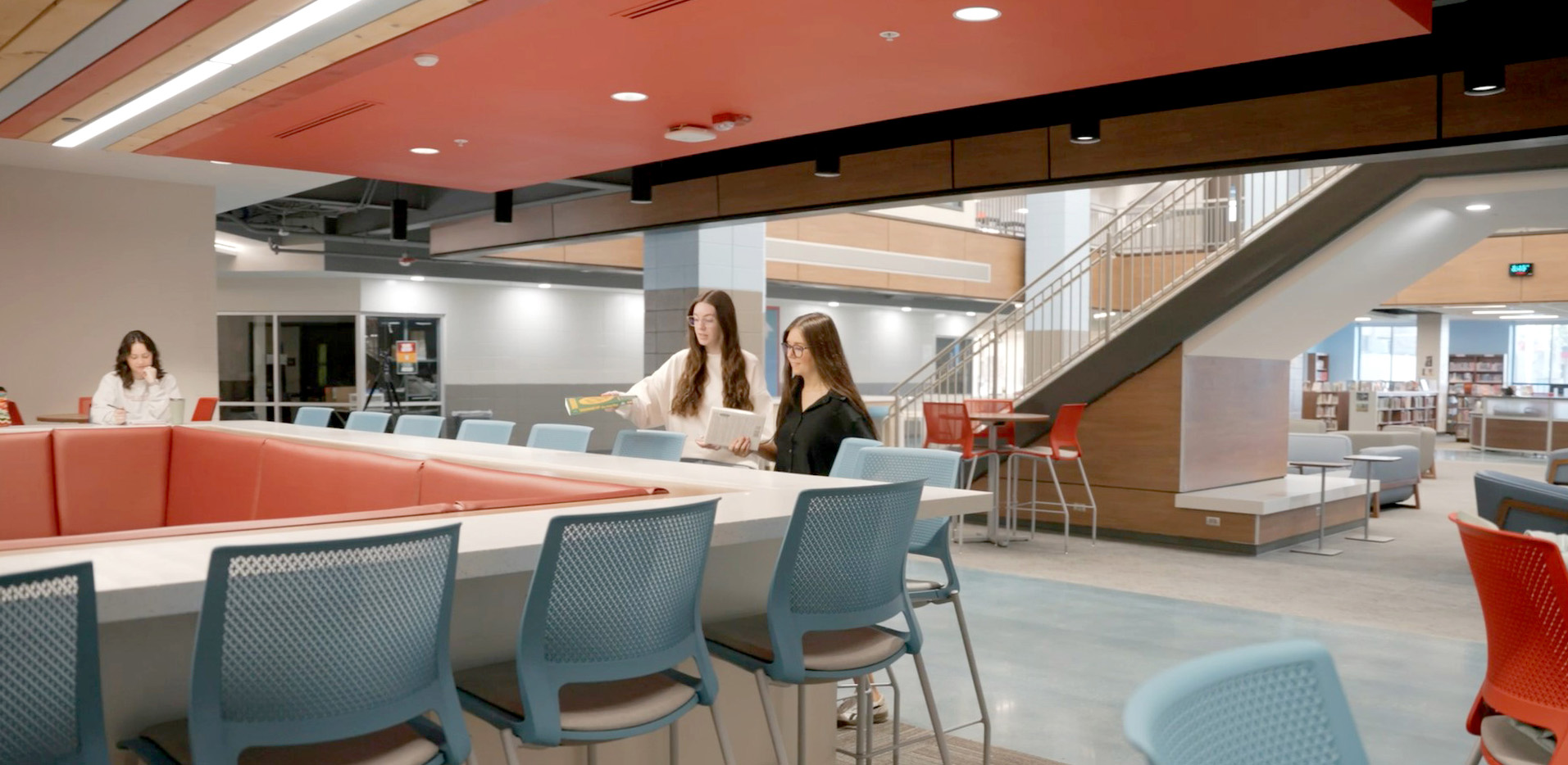 Collaborative space with bold colors with wayne high school library.