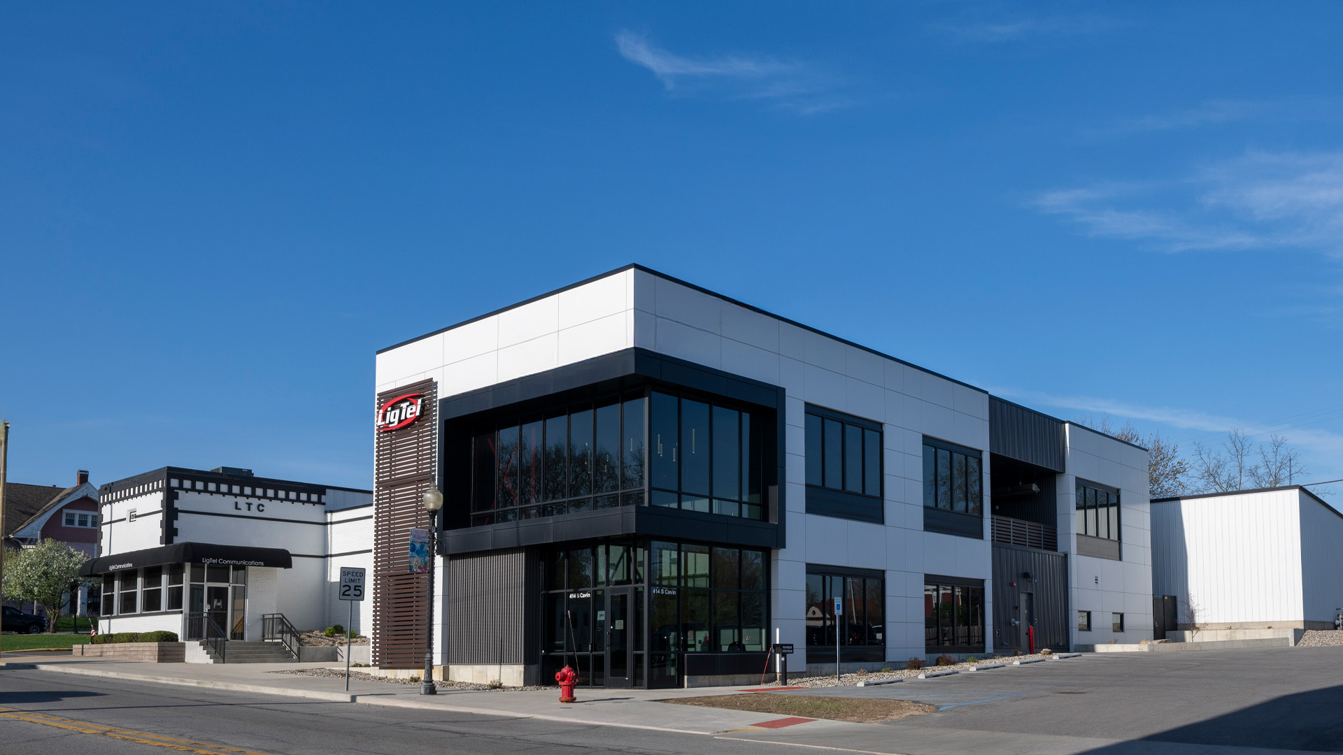 Exterior headquarters with lots of windows, sleek finishes, and branding.