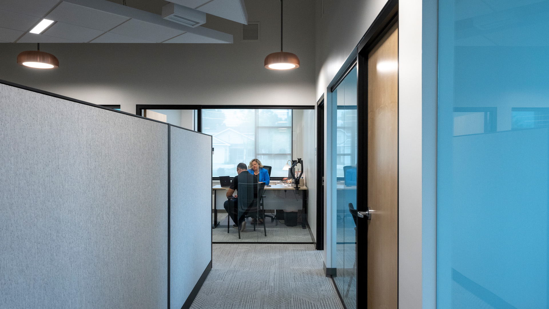 private office with large glass wall.