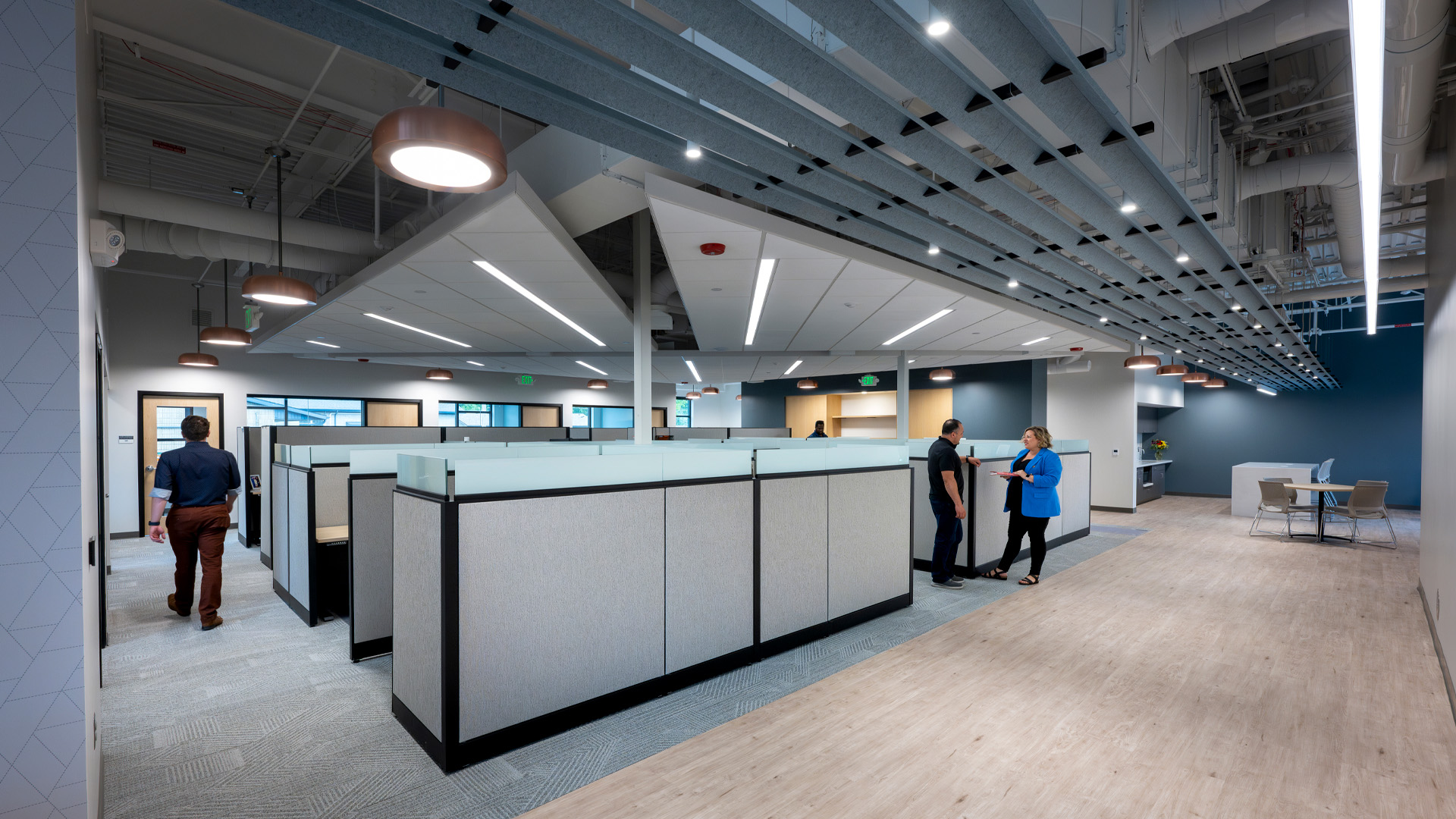 Open office with acoustical ceiling design.