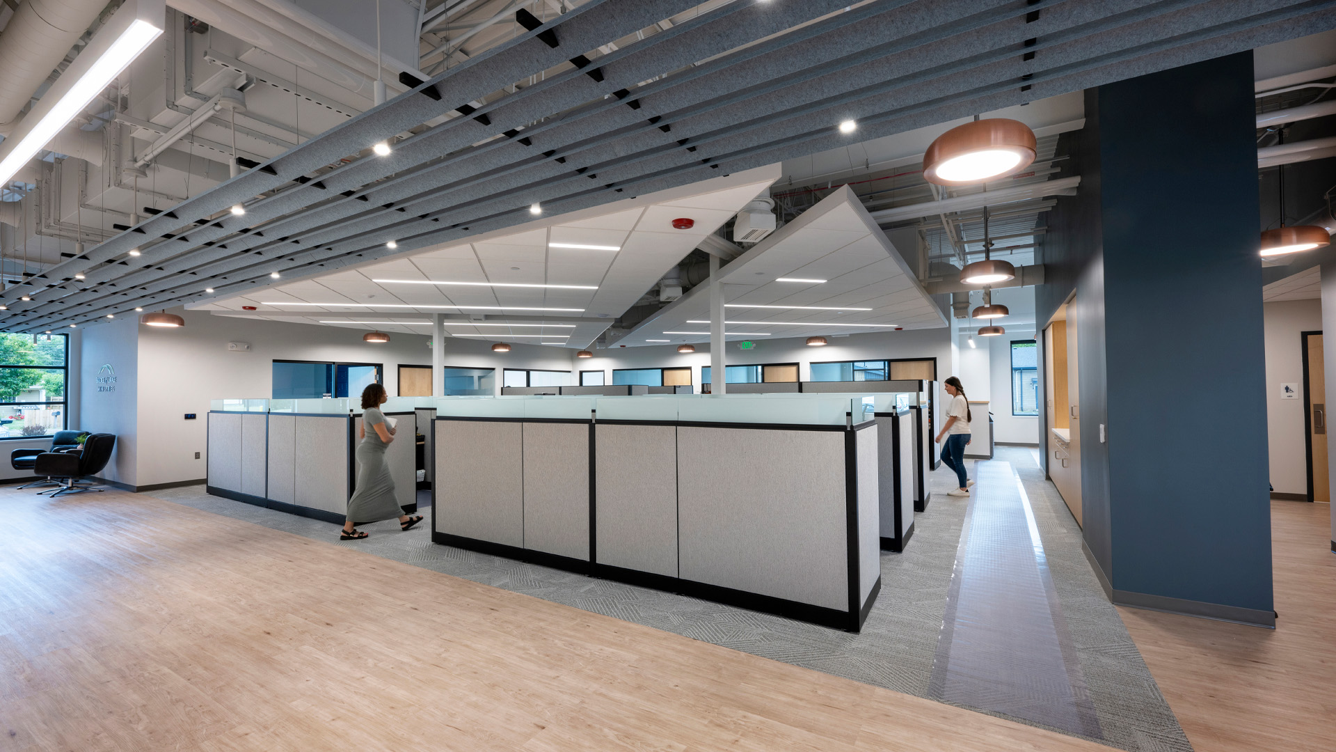 Open office with acoustical ceiling design.