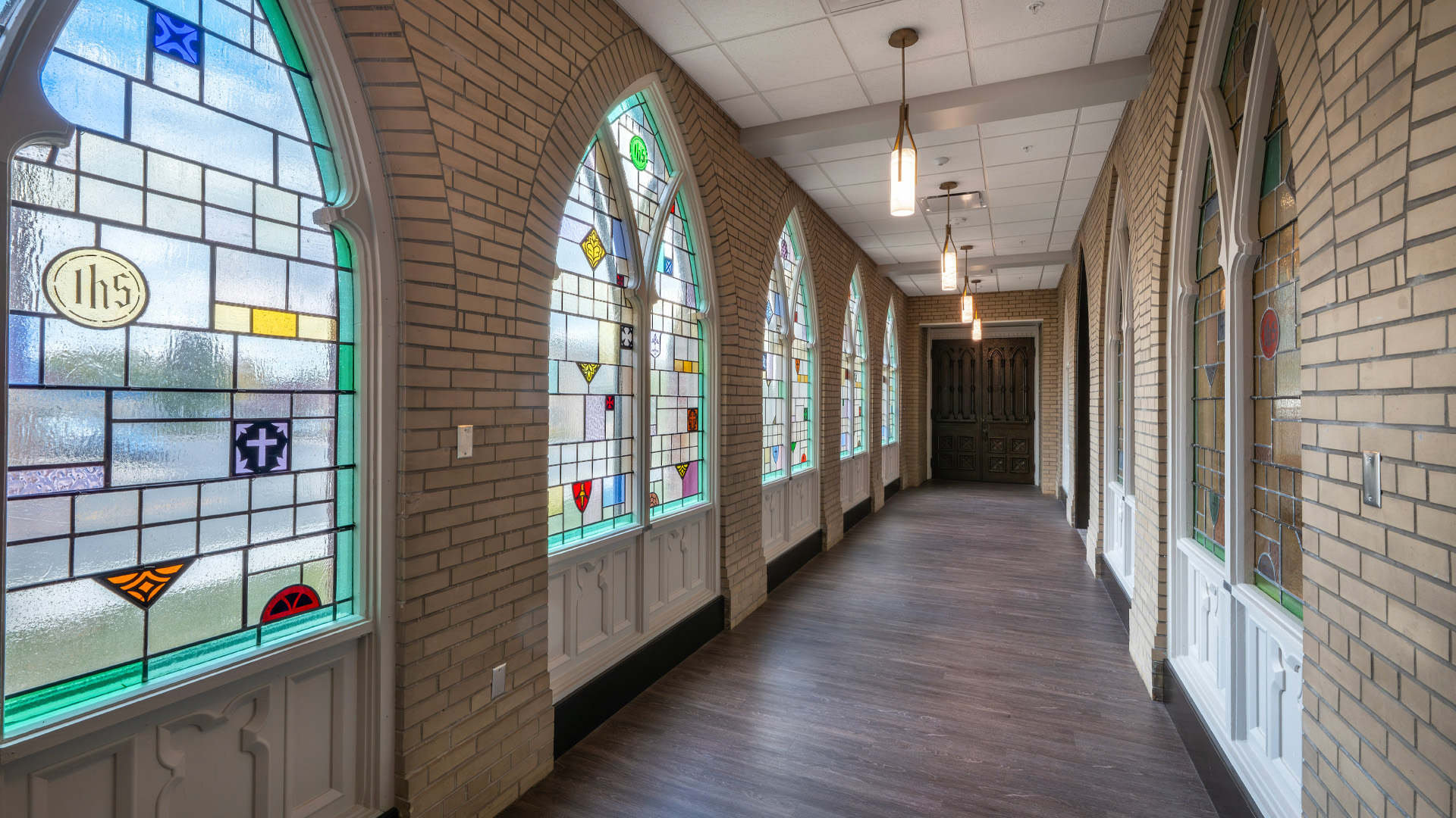 Preserved stained glass windows in a hallway at St. Pauls Lutheran Church Heritage Hall.