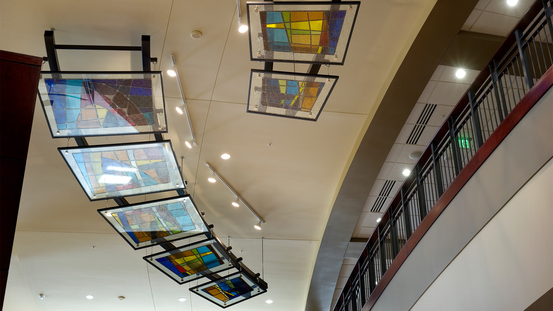 Indiana Wesleyan University Chapel Auditorium ceiling with decorative stained glass panels.