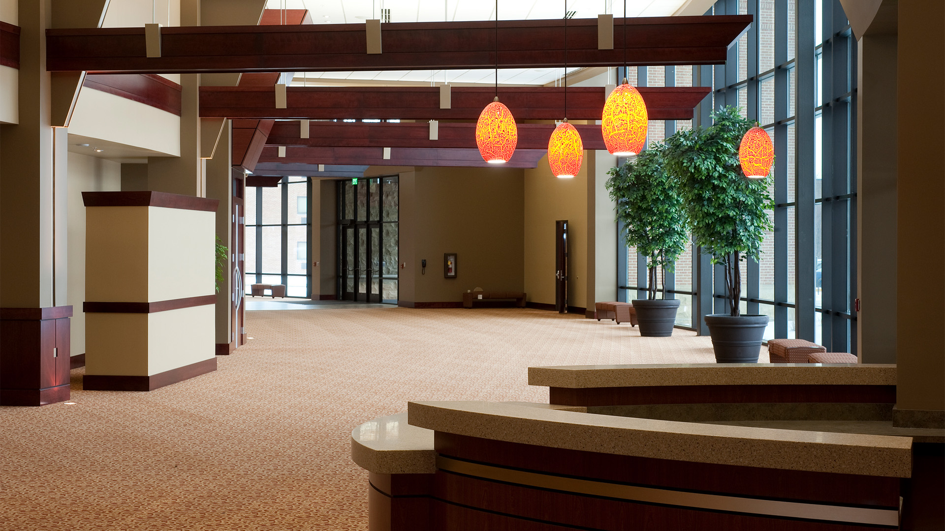 Indiana Wesleyan University Chapel Auditorium hallway and a front desk with decorative lights hanging from the ceiling.
