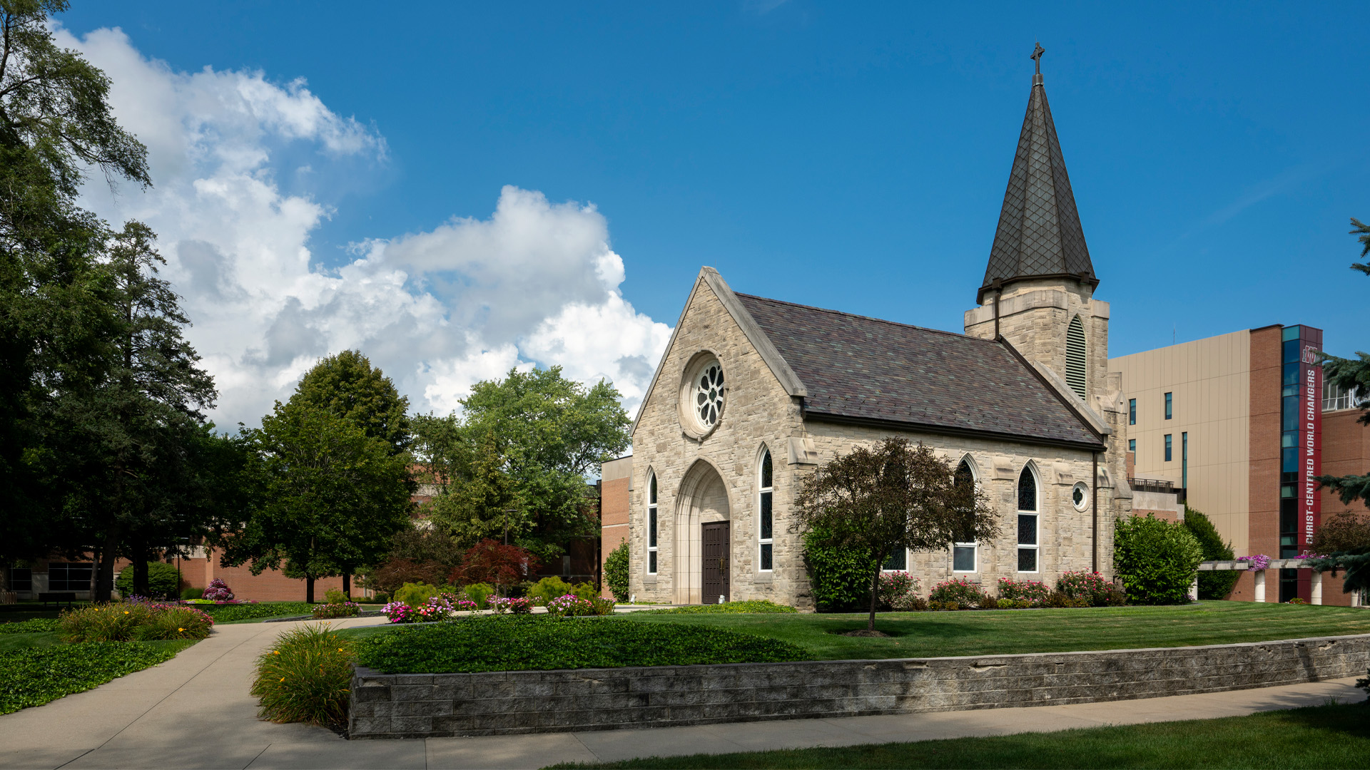 Indiana Wesleyan University Prayer Chapel Building made of stone with a steeple and stained glass windows.