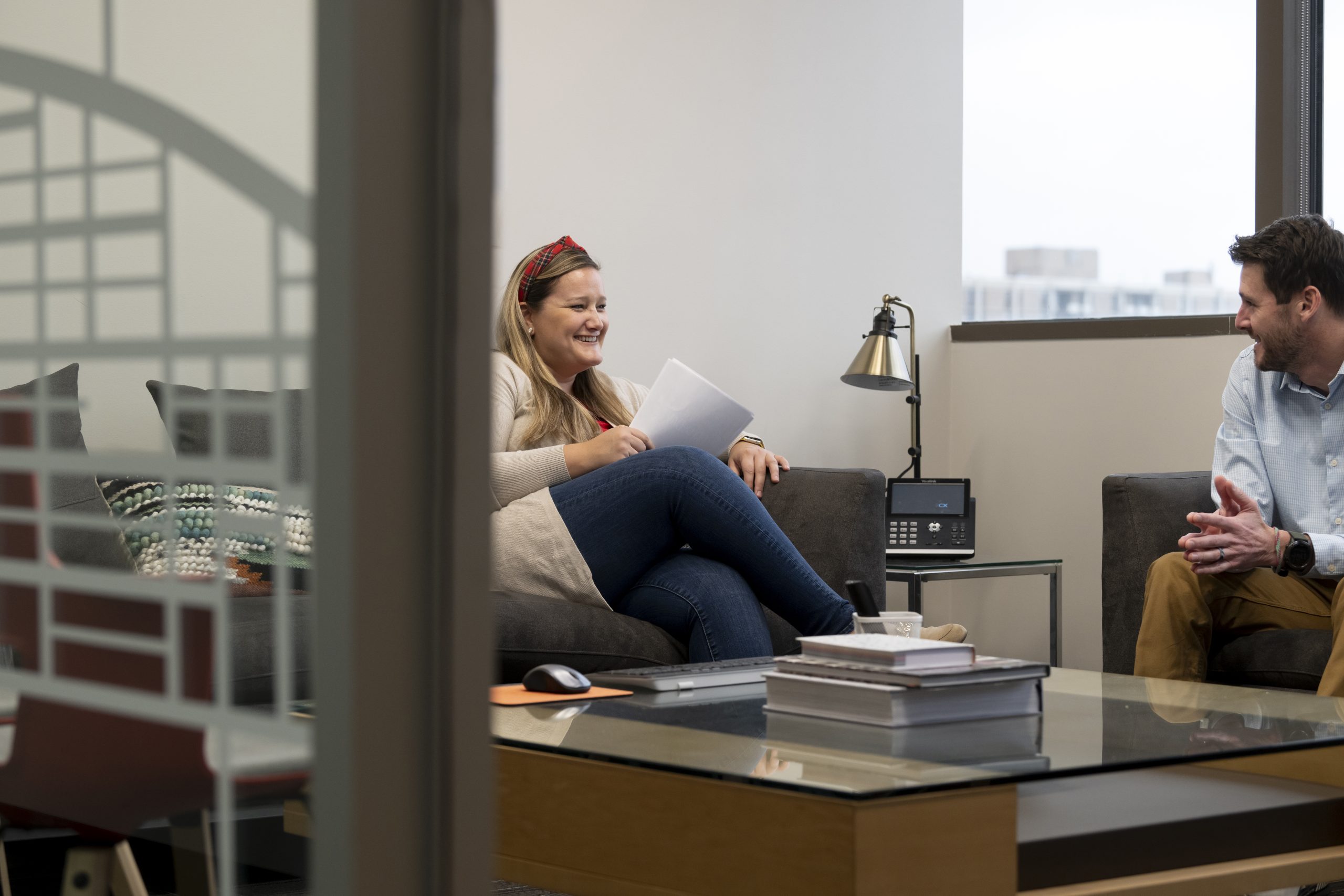 Two People Sitting in Lounge