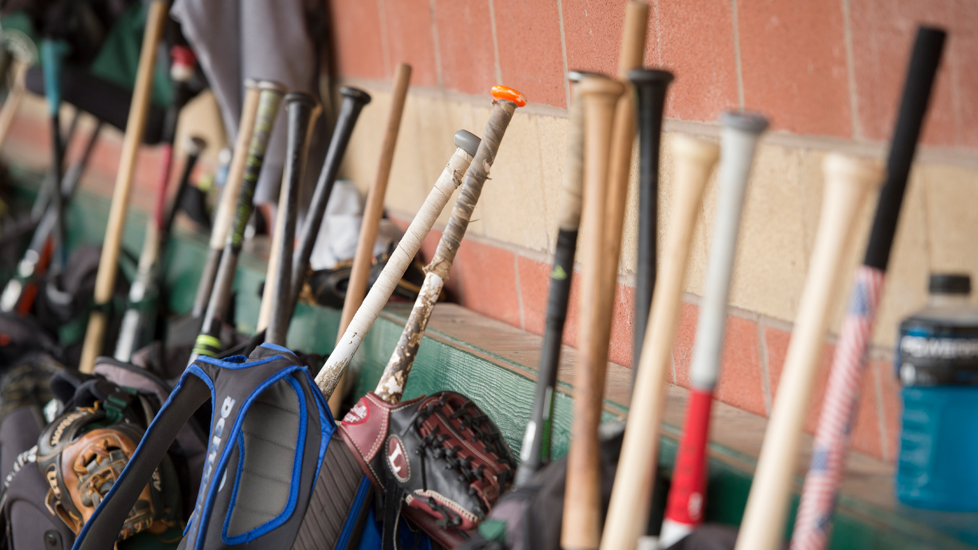 Huntington University Forester Baseball dugout with bats and mits.