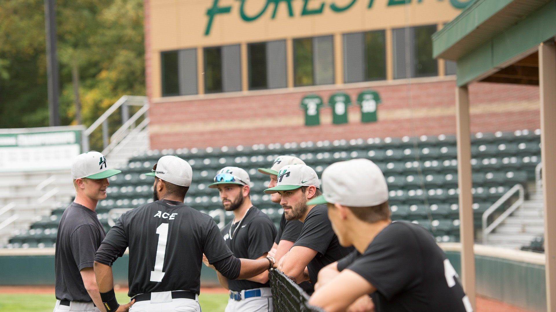 Huntington University Forester baseball players on field.