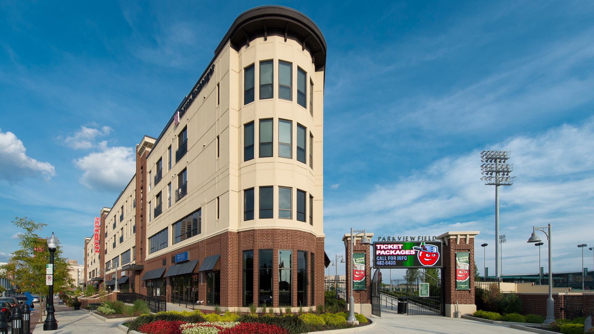 Exterior view of The Harrison and entrance of Tin Caps Stadium.