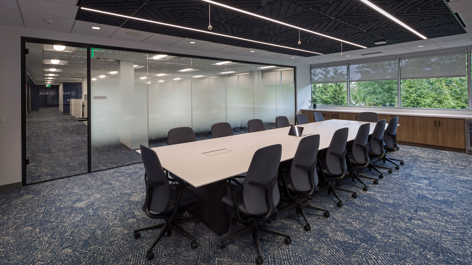Conference room with bold ceiling and lighting design.