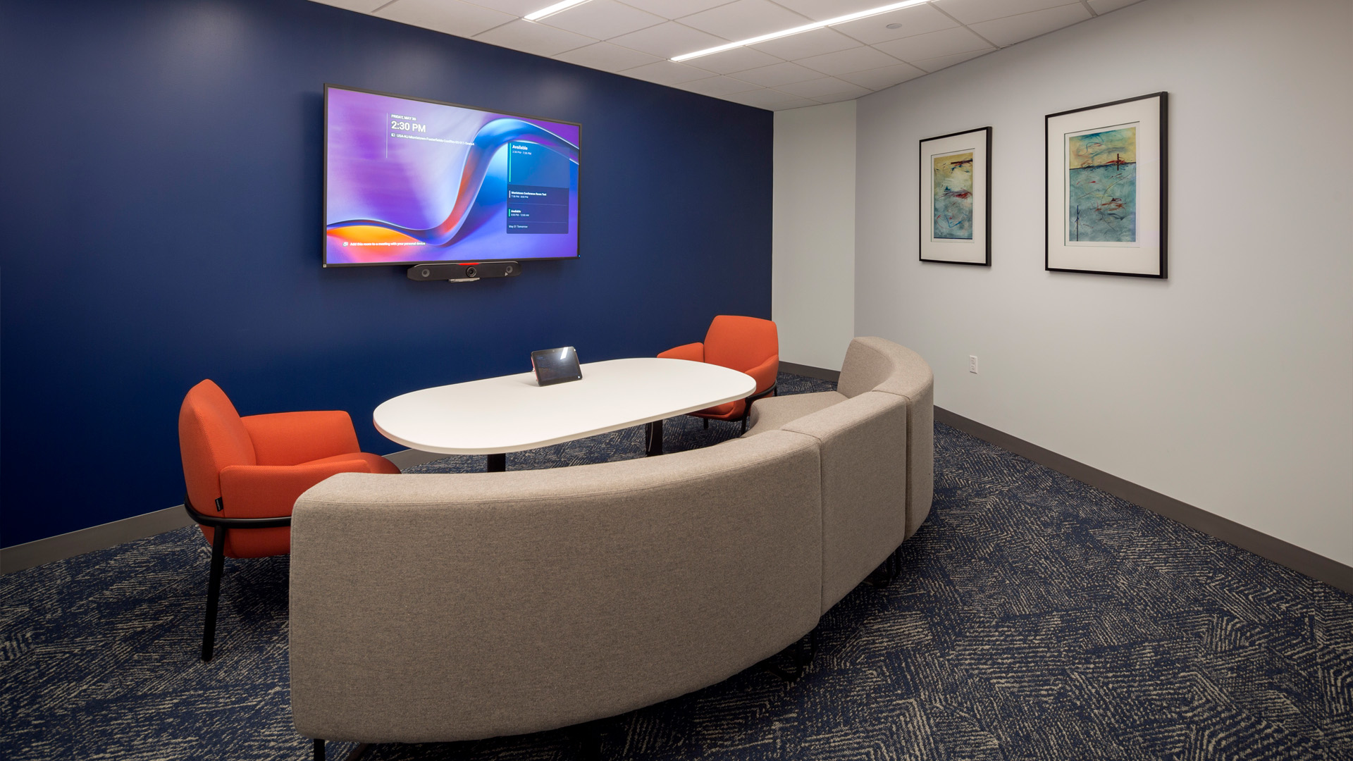 Flexible seating conference room with glass entry.