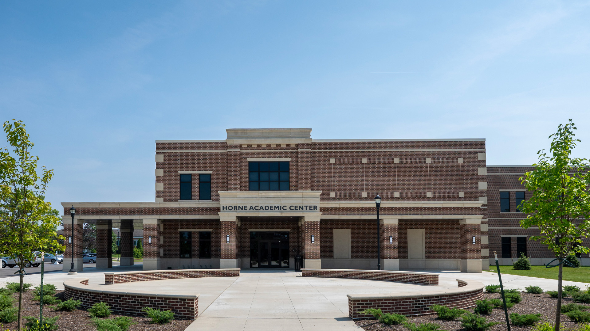 Taylor University's Horne Academic Center, a brick building with a circular patio in front.