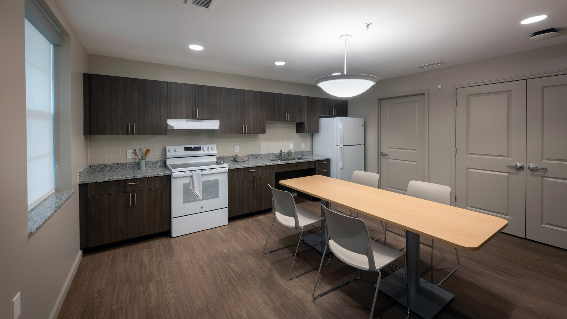 Taylor University residential village kitchen with a dining table.