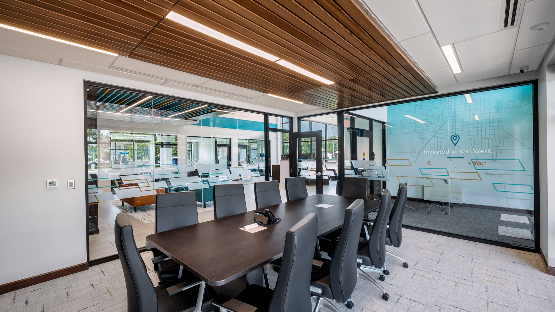 Bank branch conference rooms with warm wood ceiling and lighting detail.