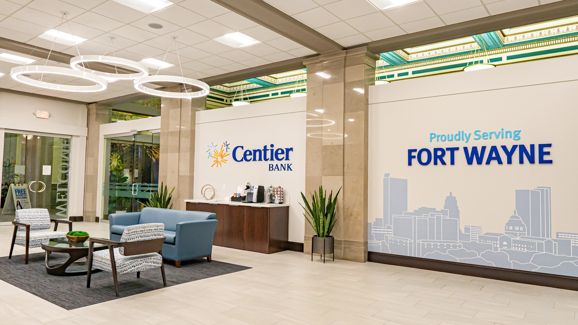 Centier Bank Branch lobby with comfortable seating, private offices, circular lights, and branded environments.