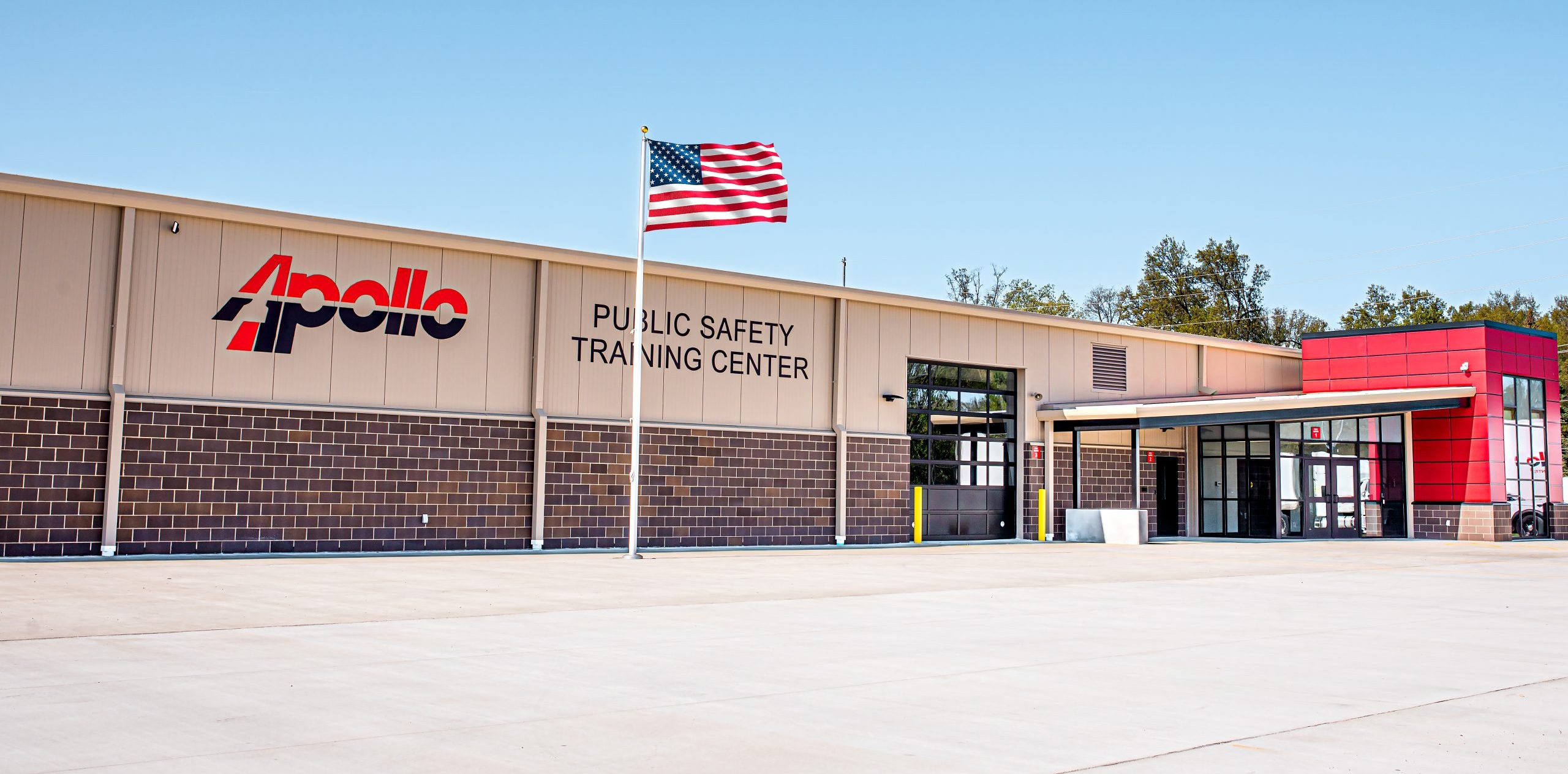 Technical education facility exterior with brick and bold branding.