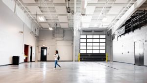 Industrial technical classroom with large operational garage door.