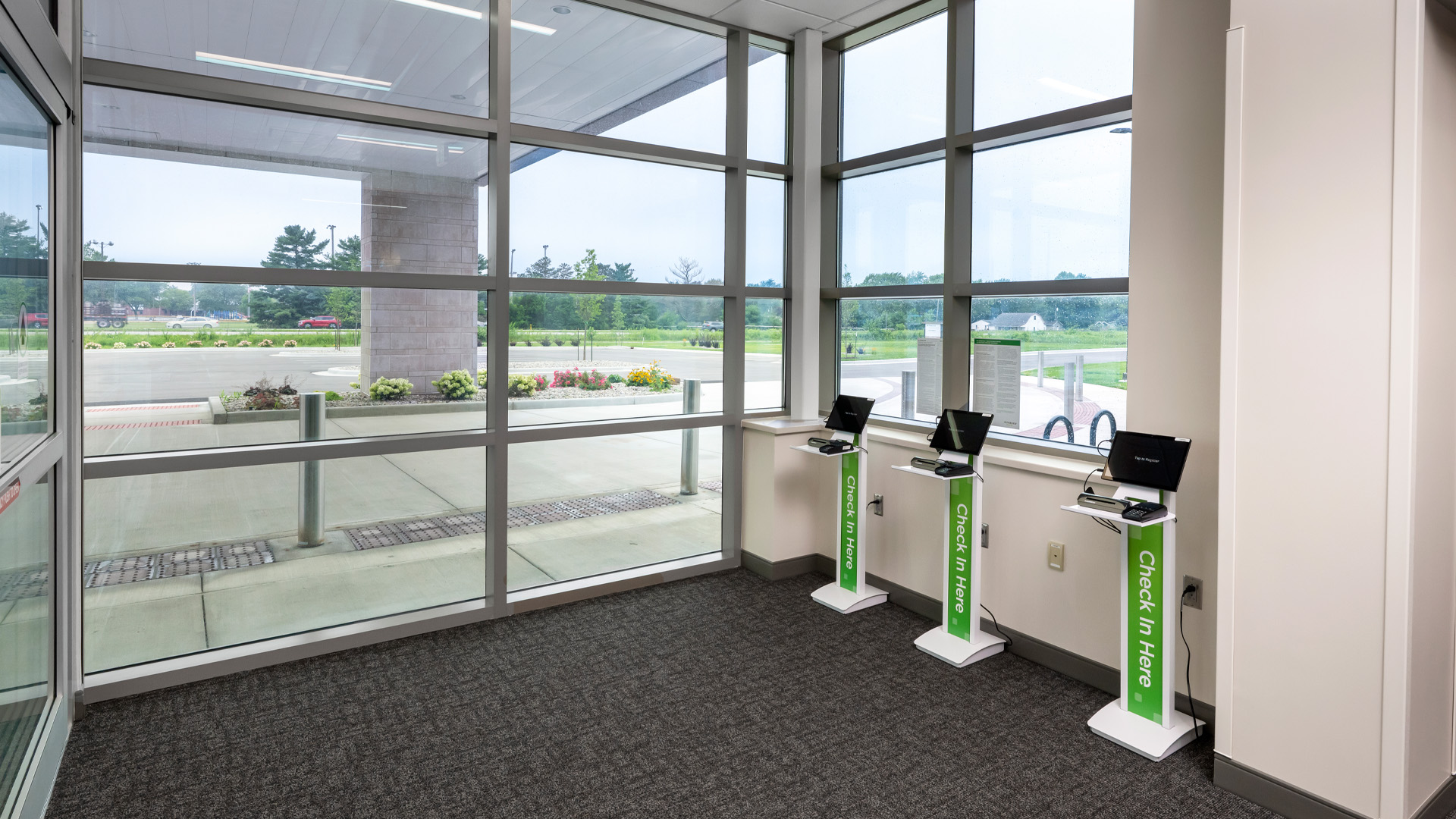 PPG Parkview Huntertown Clinic check-in Kiosks by large windows.