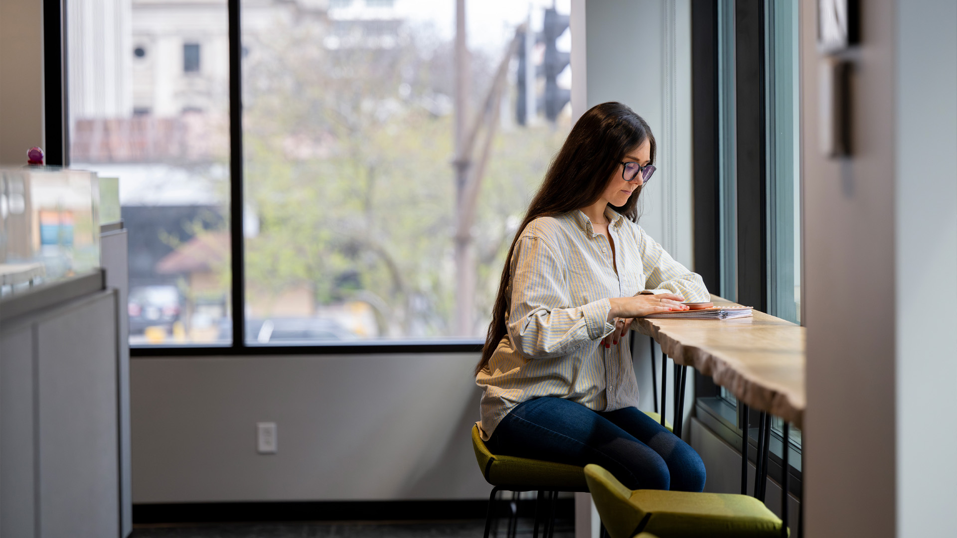 Women working at a high-top workspace in Greenway Bank.