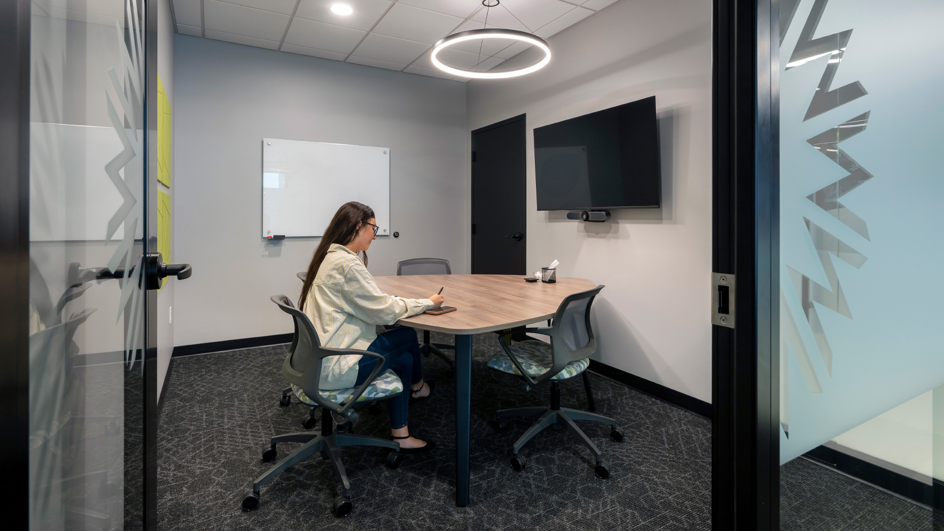 Private conference room in Greenway Bank with branded graphic privacy film.