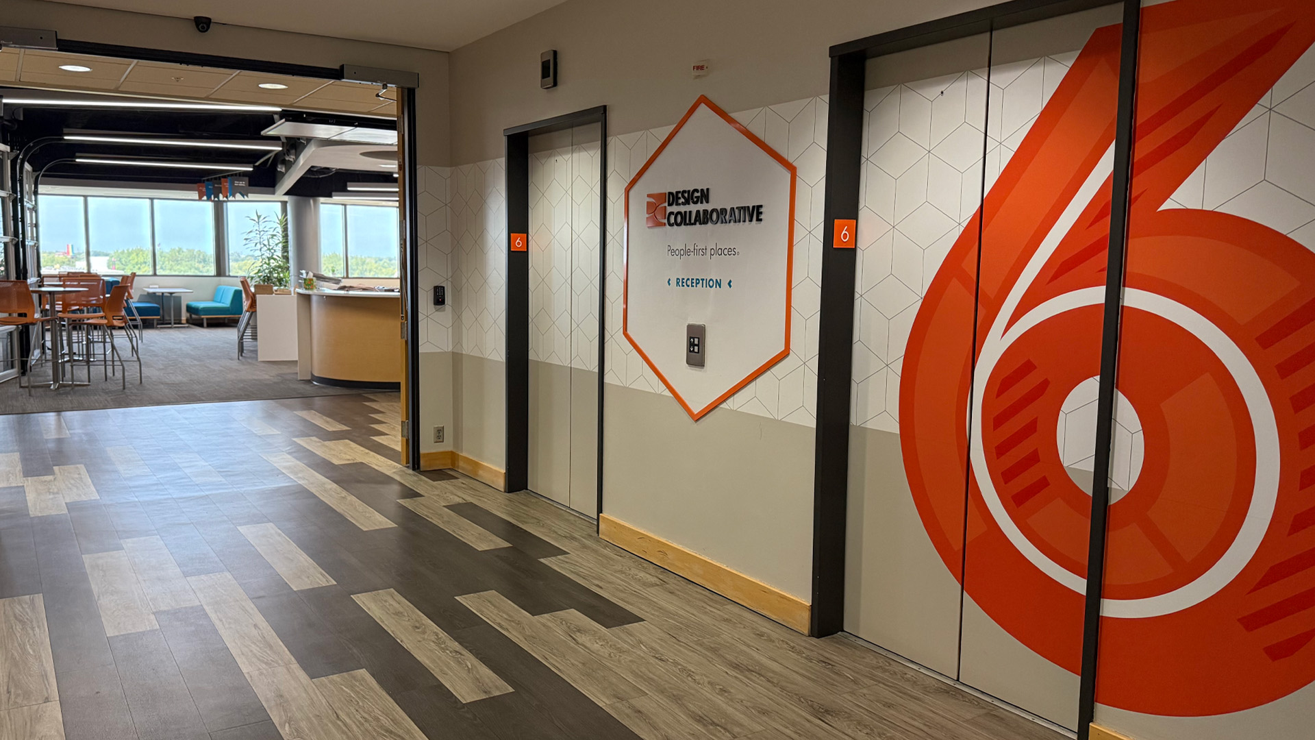 Branded Graphic designs in the elevator lobby of the Design Collaborative office on the 6th floor of the 1st Source Bank building in downtown Fort Wayne, IN.