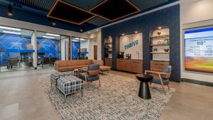 Credit union lobby with private rooms, decorative lobby seating, and branded graphics.