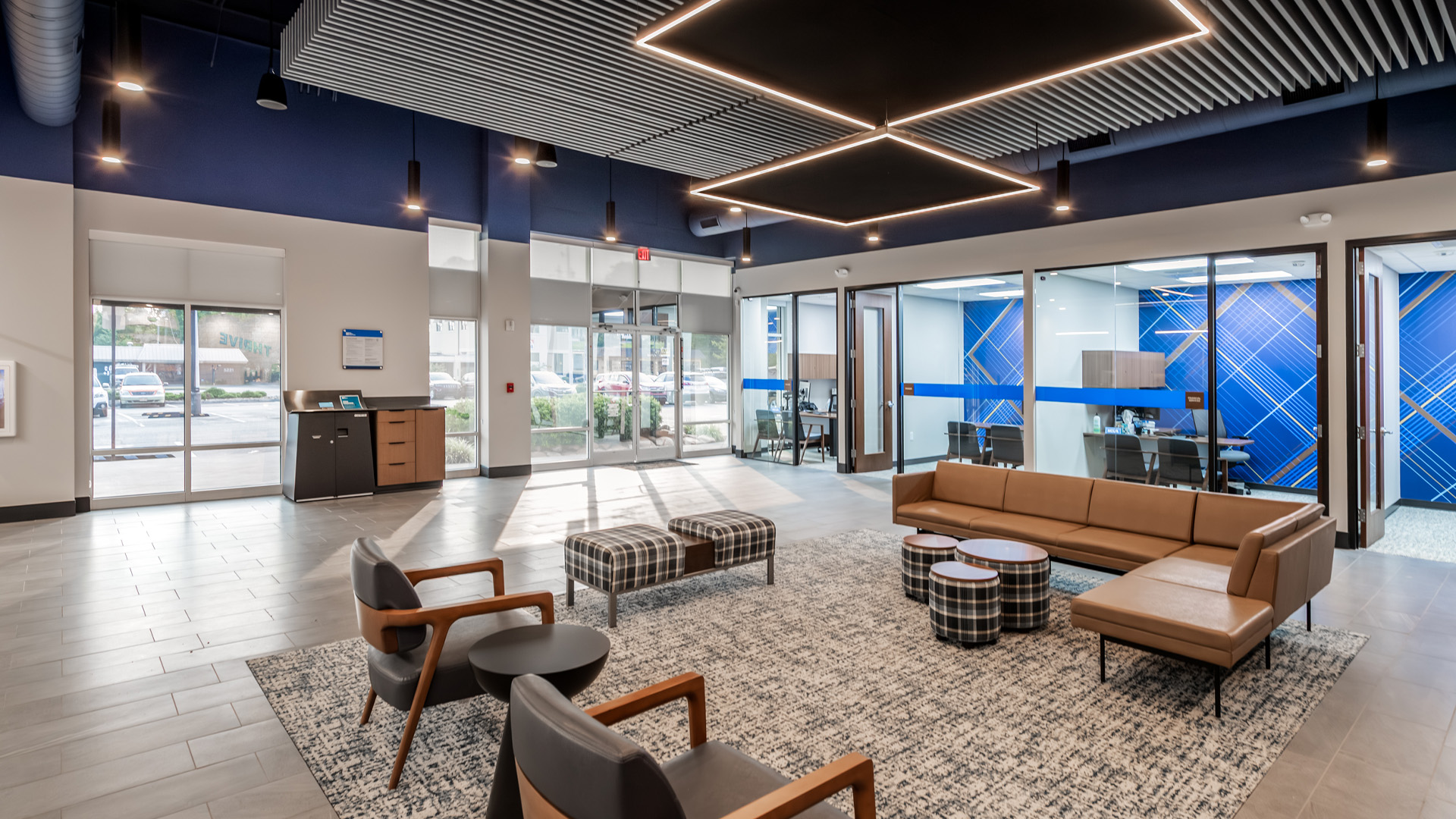 ORNL Federal Credit Union lobby with branded graphic designs in private rooms and lobby seating.
