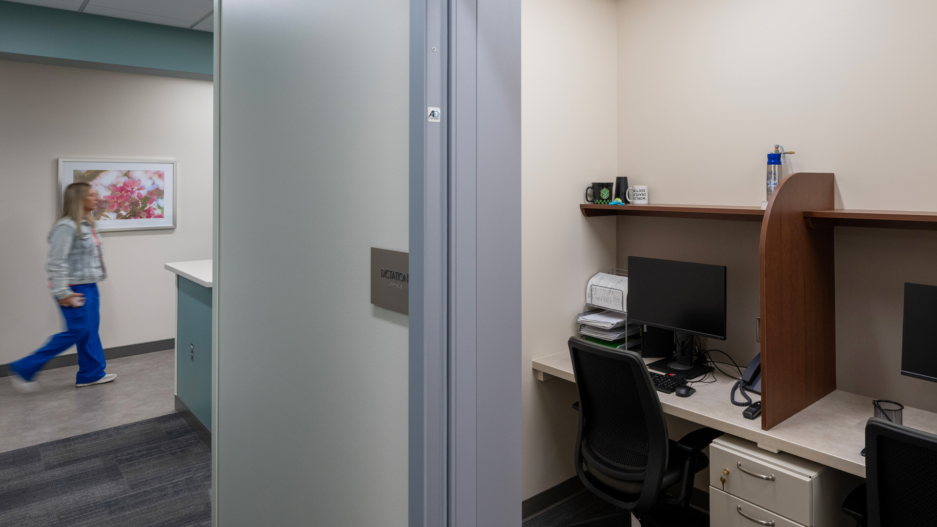 Hallway with women walking past at Parkview Physicians Group's Warsaw Clinic.