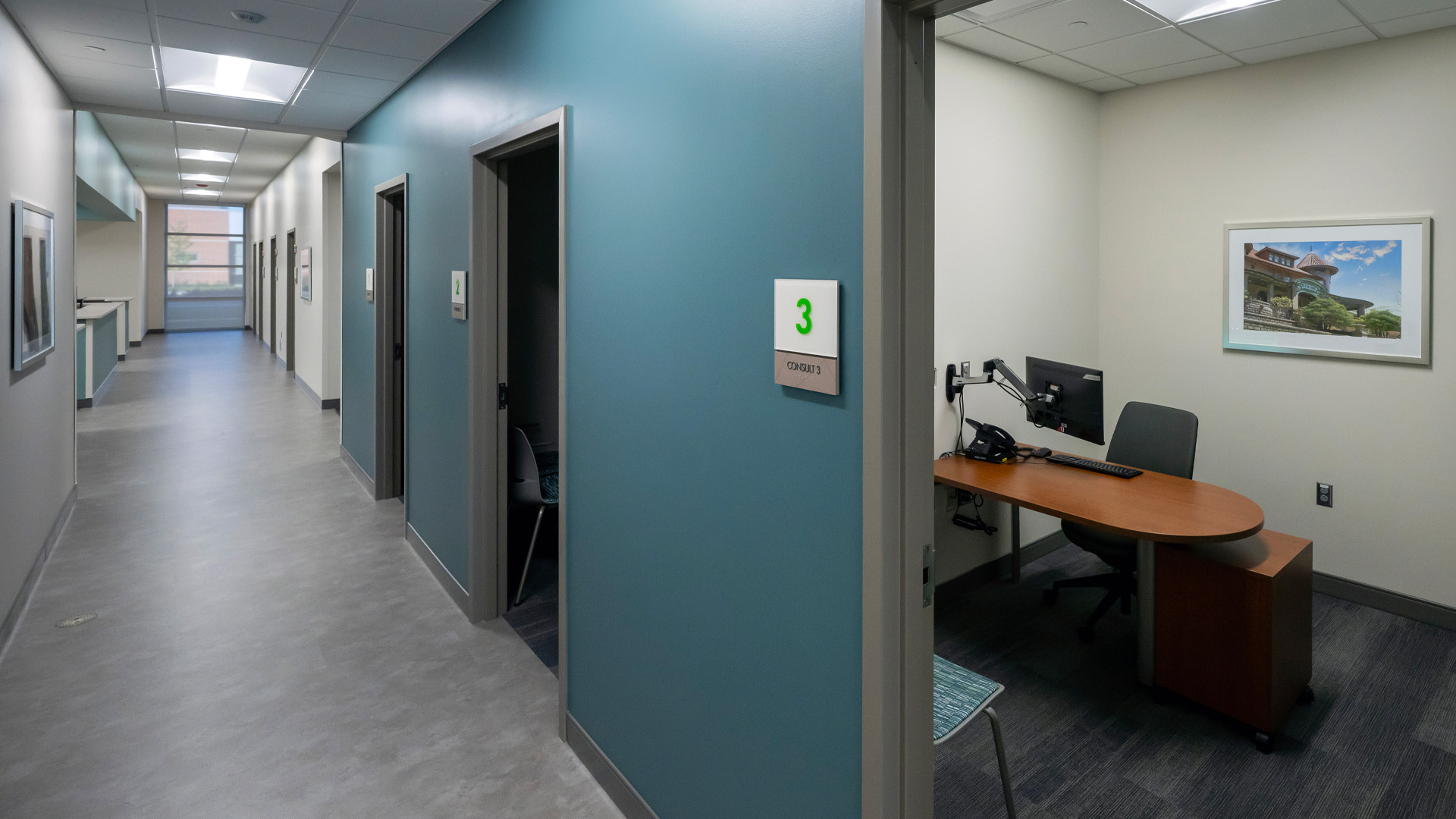 Hallways with offices along a blue wall at Parkview Physicians Group's Warsaw Clinic.
