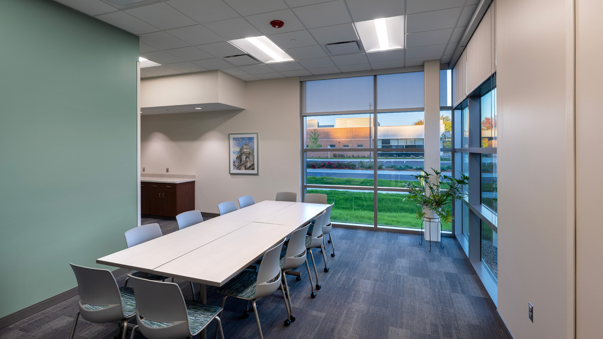 Multipurpose Meeting room with large windows and blue wall at Parkview Physicians Group's Warsaw Clinic.