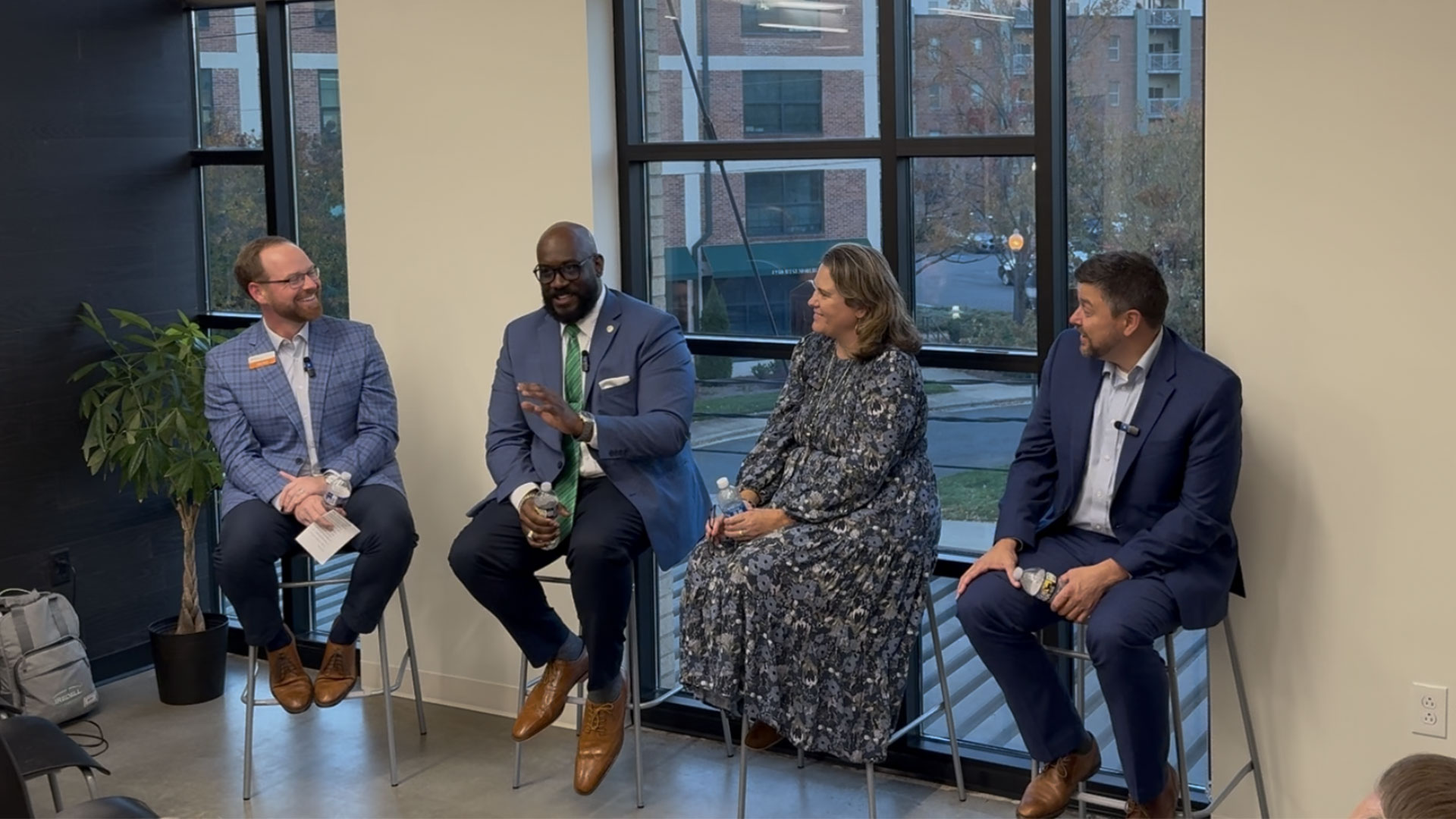 Economic development officials, business people, panelists, professional, candid, talking, conversation