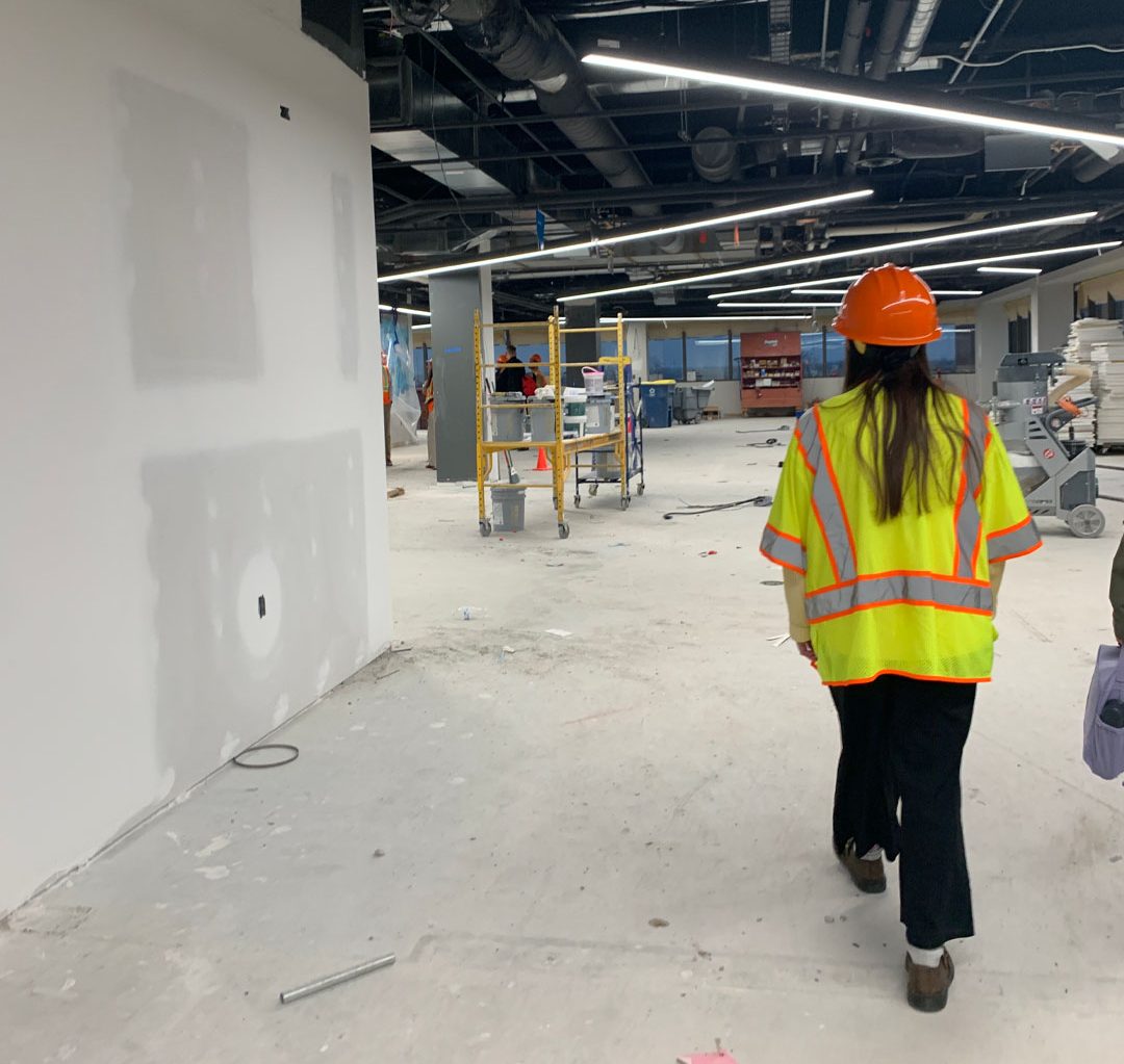 Design Collaborative employees walks through construction of the Design Collaborative Fort Wayne office renovation.