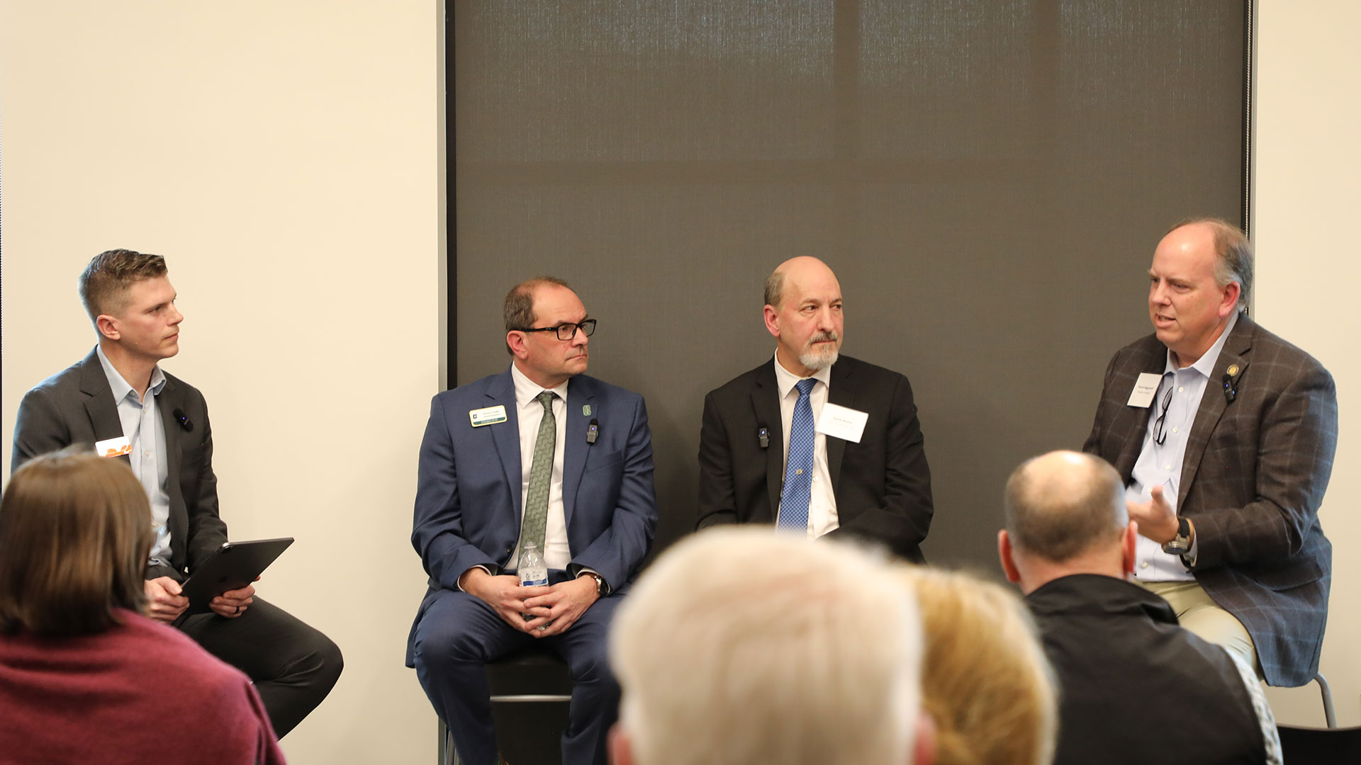 Full scale education panelists talking in front of crowd at the Design Collaborative's office in Charlotte.