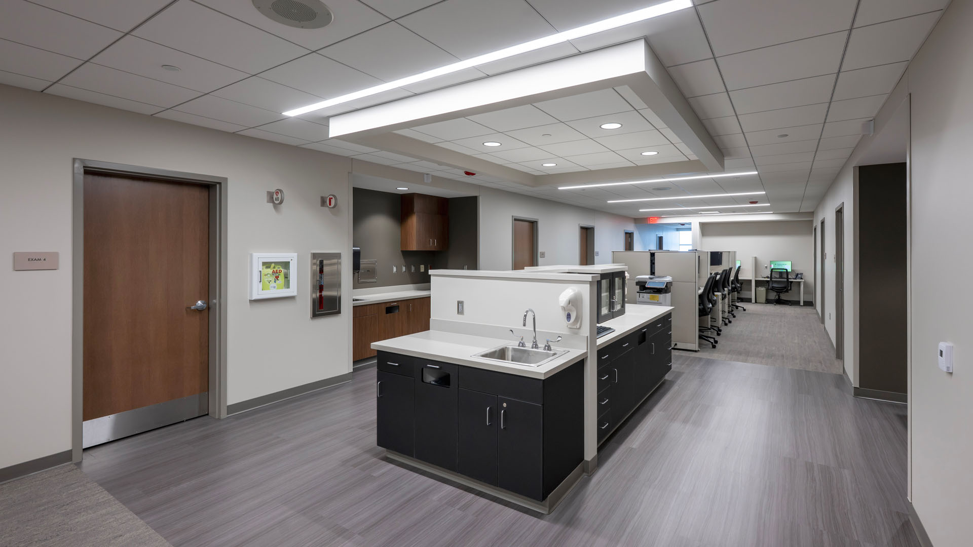 Wide hallway at Parkview Southwest HOD Clinic with hand-washing stations in the middle.