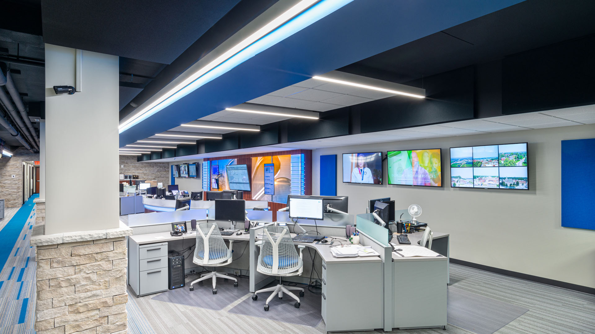 Quincy Broadcasting WGEM news studio with decorative blue accents and an open office layout.