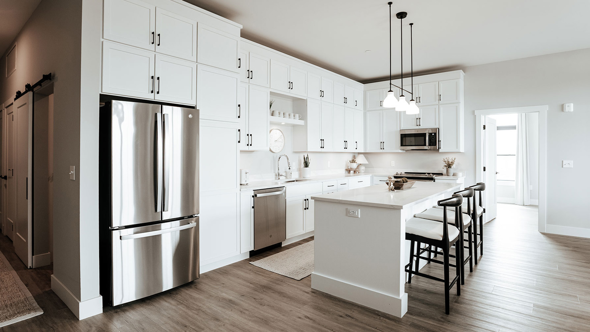 A spacious modern apartment unit kitchen in The Pearl in downtown Fort Wayne.