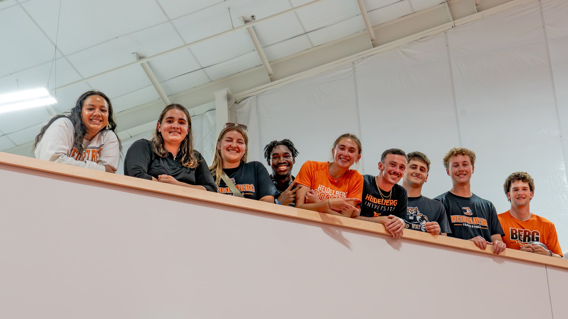 Students happily pose for a picture at the dedication event for Heidelberg University's Frann’s Fieldhouse.