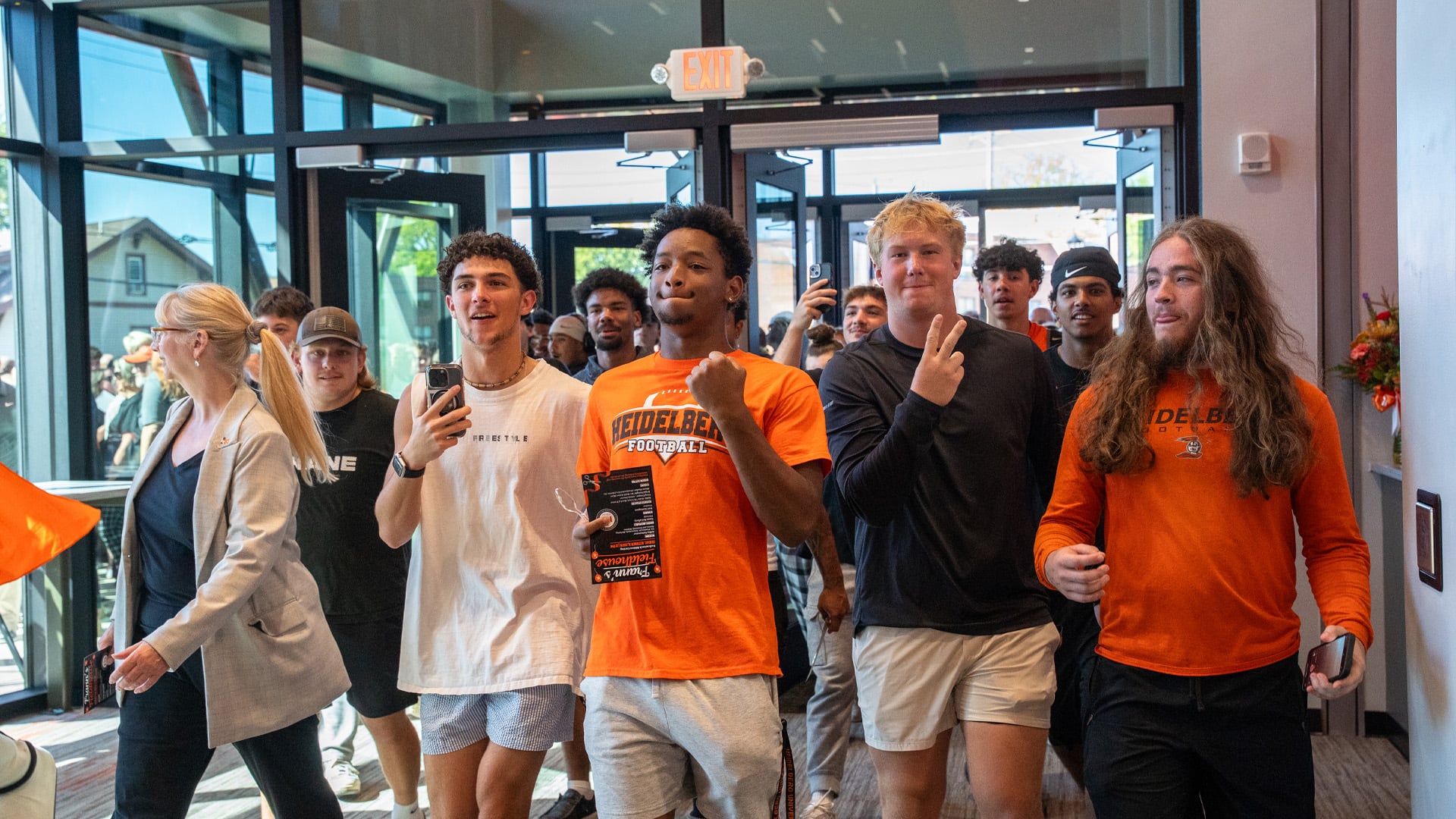 Students walk in excited for the first time to Heidelberg University's Frann’s Fieldhouse at the dedication event for the building.