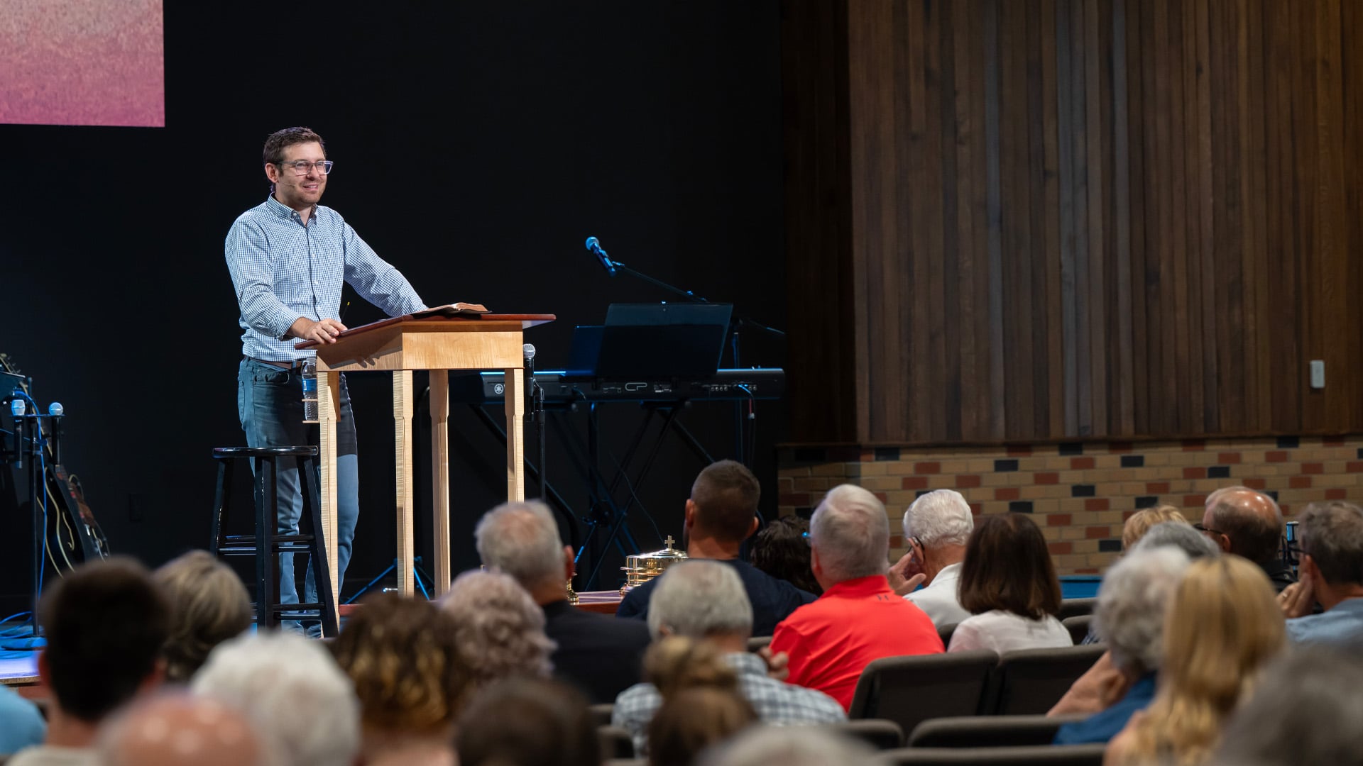 Pastor speaks to congregation on Sunday morning in the Headwaters Church Sanctuary in Fort Wayne Indiana.