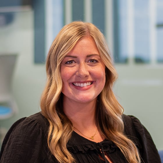 Design Collaborative Interior Designer Avery Mortakis's headshot.